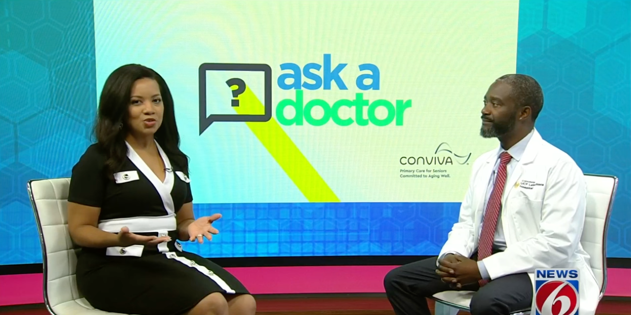 Dr. Duron Lee on set with host of WKMG's Ask A Doctor segment