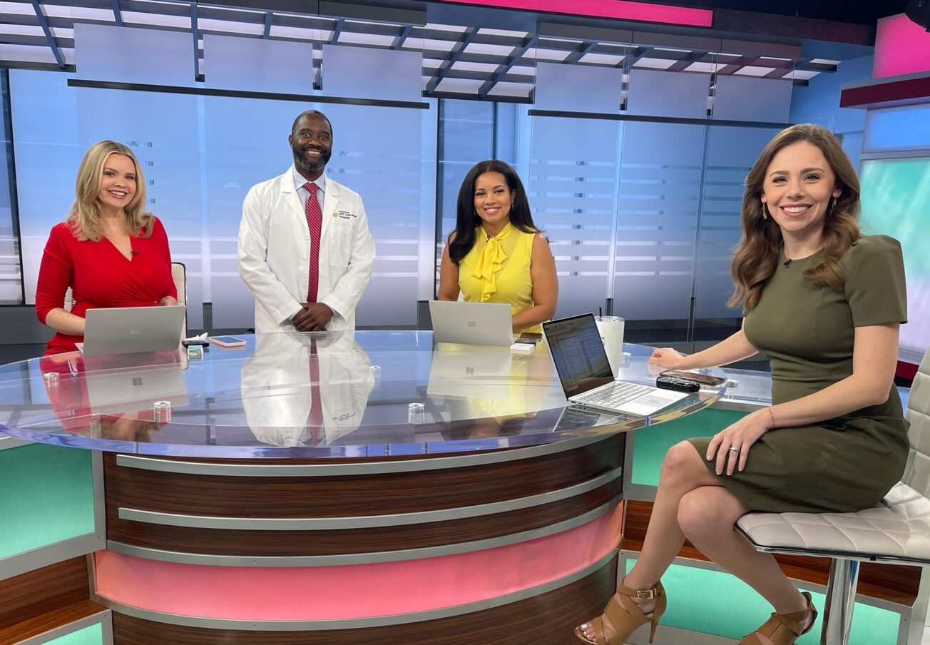 Dr. Duron Lee on WKMG set with news anchors