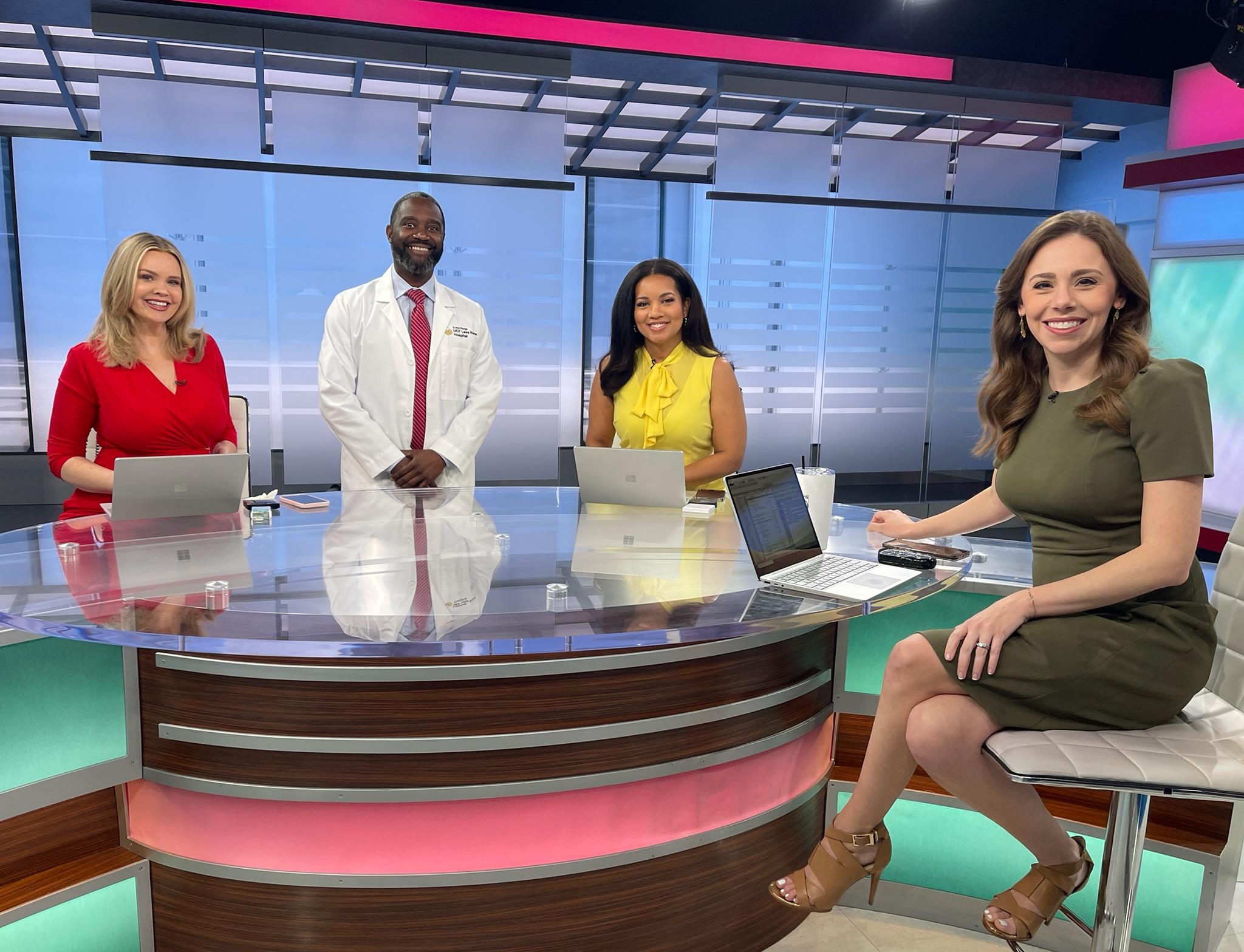 Dr. Duron Lee on WKMG set with news anchors