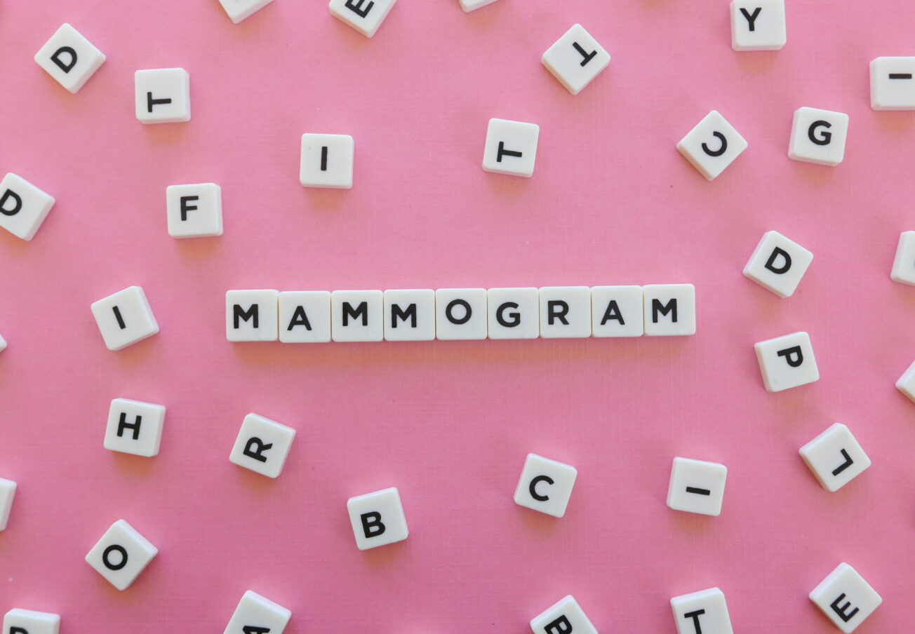 Mammogram word made of square letter word on pink background.